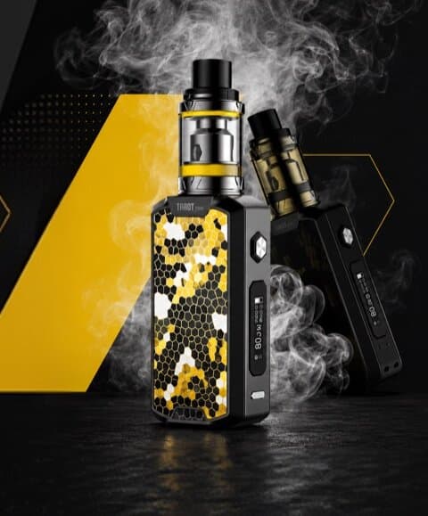 Close-up of a honeycomb-patterned vape mod kit with two tanks, wrapped in smoke